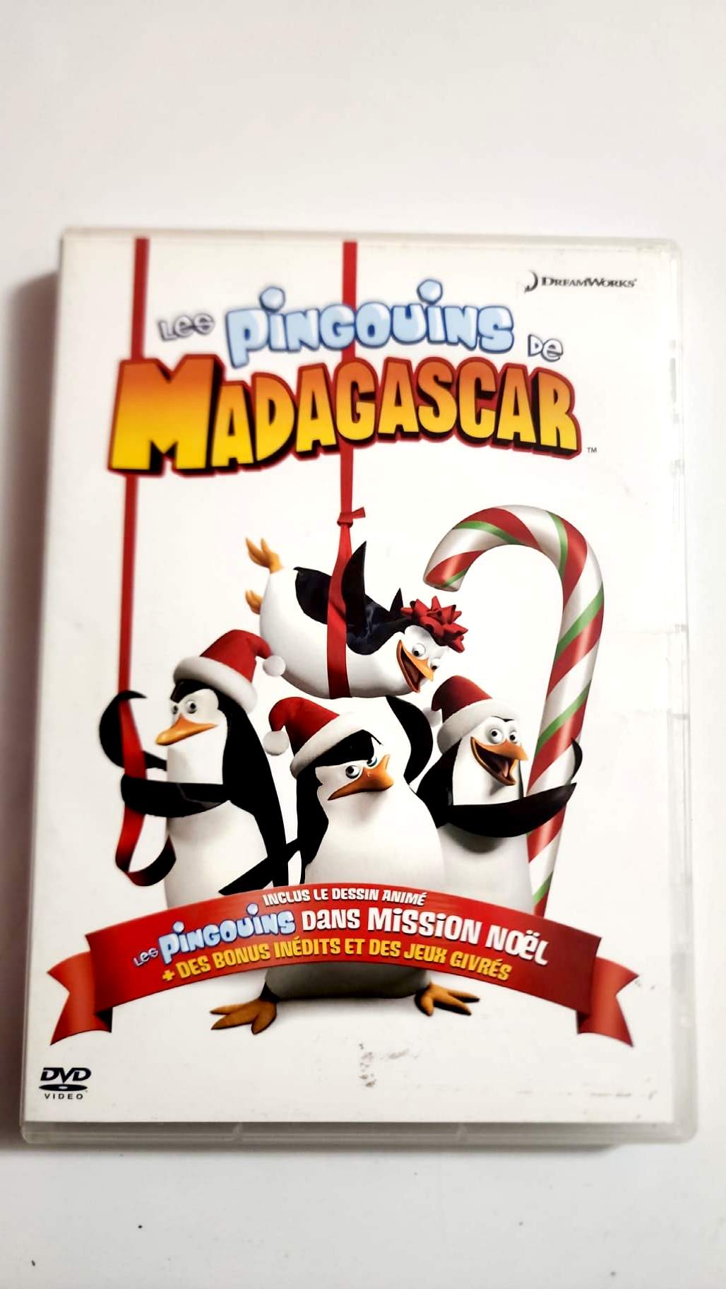 Dos de la jaquette du DVD Les Pingouins de Madagascar Mission Noël